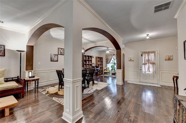 2837 Peachstone Ct, Lawrenceville, GA 30043 - entrance foyer with ornamental molding, dark wood finished floors, a decorative wall, arched walkways, and ornate columns