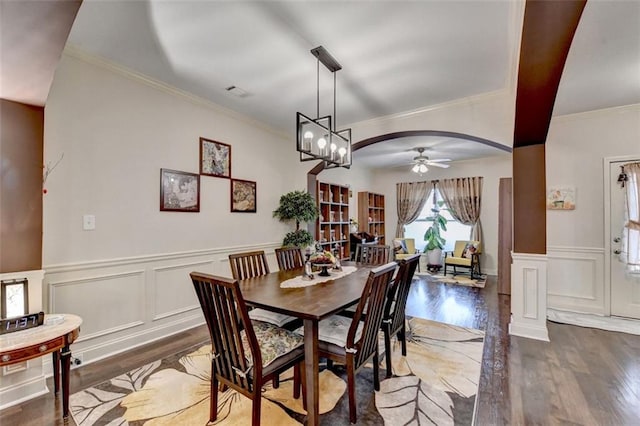 2837 Peachstone Ct, Lawrenceville, GA 30043 - dining area with ceiling fan, wood finished floors, ornamental molding, a decorative wall, and a wainscoted wall