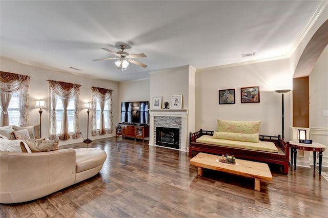 2837 Peachstone Ct, Lawrenceville, GA 30043 - living area featuring a ceiling fan, wood finished floors, ornamental molding, and a stone fireplace