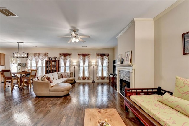 2837 Peachstone Ct, Lawrenceville, GA 30043 - living area featuring a fireplace, ceiling fan, dark wood-style floors, and ornamental molding