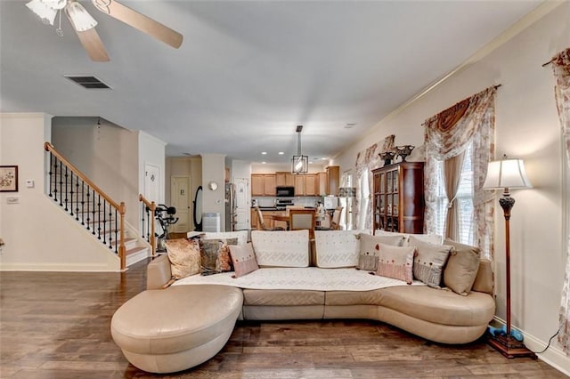2837 Peachstone Ct, Lawrenceville, GA 30043 - living room featuring dark wood finished floors, baseboards, stairway, and ceiling fan