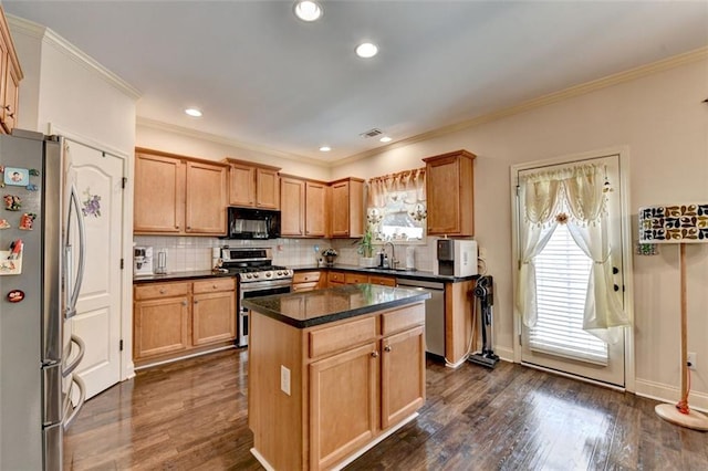 2837 Peachstone Ct, Lawrenceville, GA 30043 - kitchen with stainless steel appliances, a sink, dark countertops, decorative backsplash, and a kitchen island