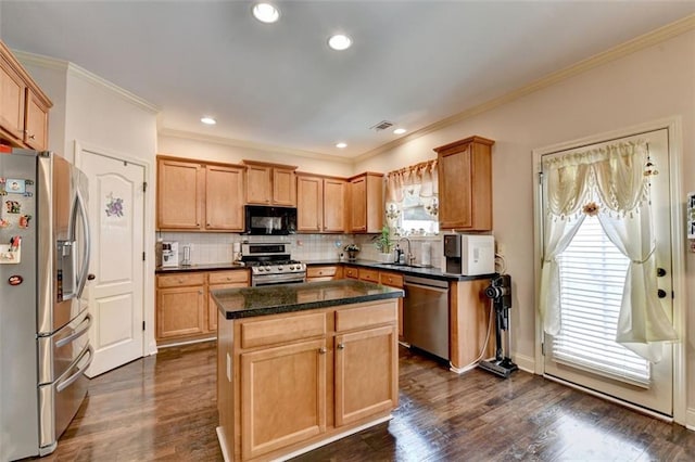 2837 Peachstone Ct, Lawrenceville, GA 30043 - kitchen featuring stainless steel appliances, healthy amount of natural light, a center island, decorative backsplash, and ornamental molding