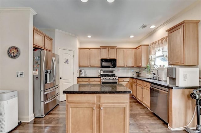 2837 Peachstone Ct, Lawrenceville, GA 30043 - kitchen with appliances with stainless steel finishes, a sink, light brown cabinets, wood finished floors, and ornamental molding