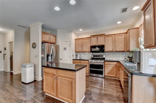 2837 Peachstone Ct, Lawrenceville, GA 30043 - kitchen with appliances with stainless steel finishes, crown molding, dark wood finished floors, tasteful backsplash, and a kitchen island