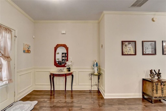 2837 Peachstone Ct, Lawrenceville, GA 30043 - foyer featuring wood finished floors, ornamental molding, and wainscoting