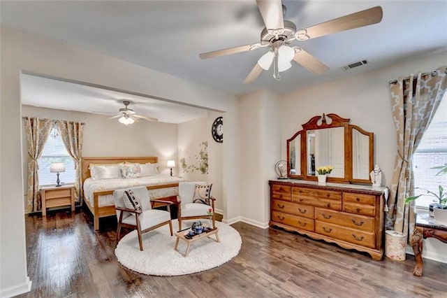 2837 Peachstone Ct, Lawrenceville, GA 30043 - bedroom featuring multiple windows, wood finished floors, baseboards, and a ceiling fan