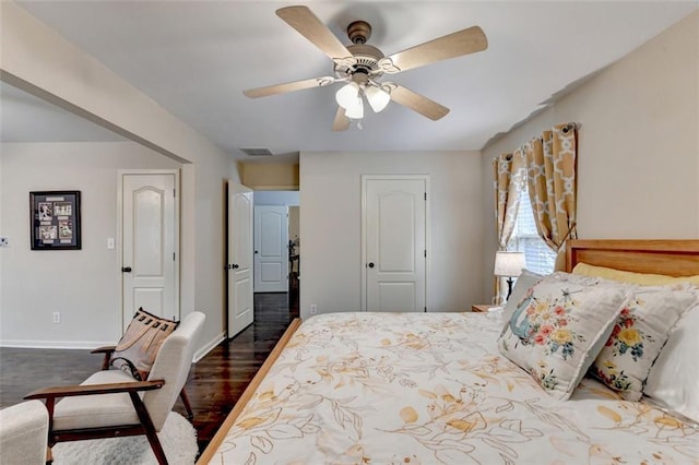 2837 Peachstone Ct, Lawrenceville, GA 30043 - bedroom with dark wood-style flooring, baseboards, and a ceiling fan