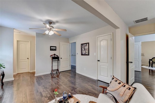 2837 Peachstone Ct, Lawrenceville, GA 30043 - living area featuring ceiling fan, dark wood finished floors, and baseboards