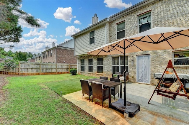 2837 Peachstone Ct, Lawrenceville, GA 30043 - rear view of property with brick siding, a patio, and a chimney