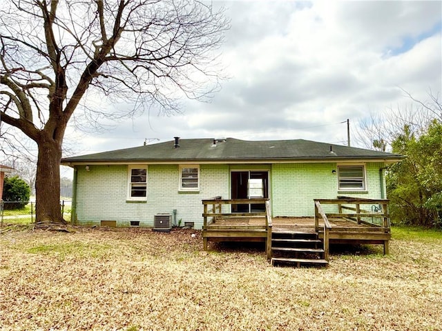 back of house with crawl space, central air condition unit, brick siding, and a deck