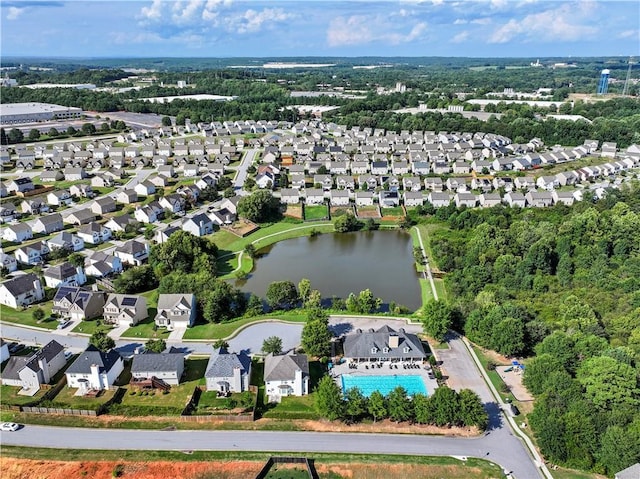 birds eye view of property with a water view and a residential view