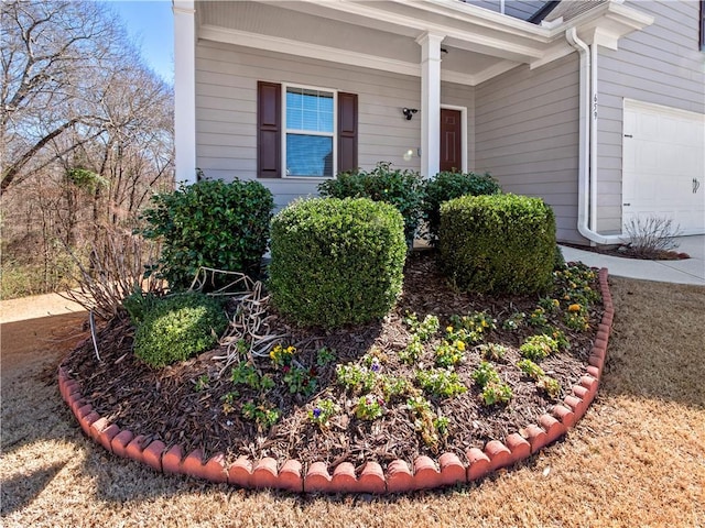 view of exterior entry with a garage