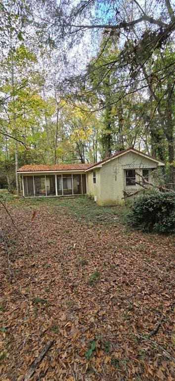 view of front of property with a sunroom