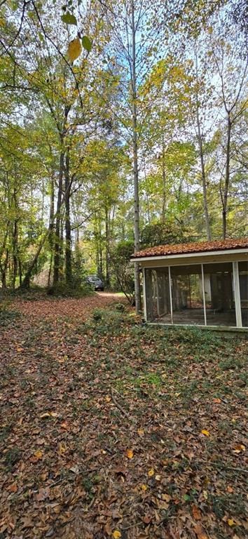 view of yard with a sunroom