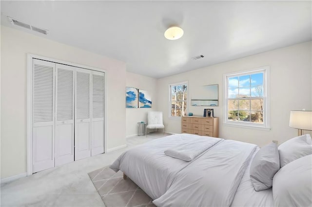 carpeted bedroom featuring a closet