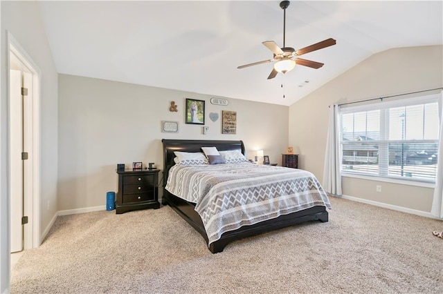 carpeted bedroom with a ceiling fan, lofted ceiling, and baseboards