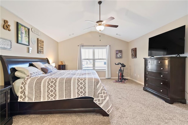 bedroom featuring a ceiling fan, carpet, vaulted ceiling, and baseboards