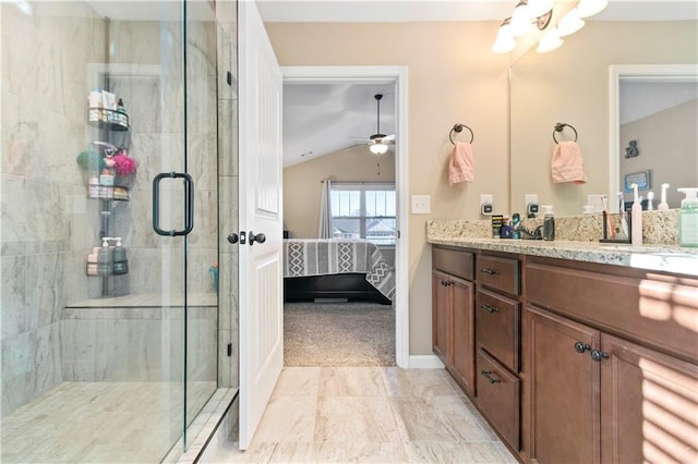 bathroom with connected bathroom, lofted ceiling, ceiling fan, vanity, and a shower stall