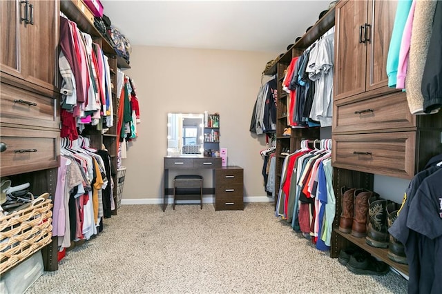 walk in closet with carpet