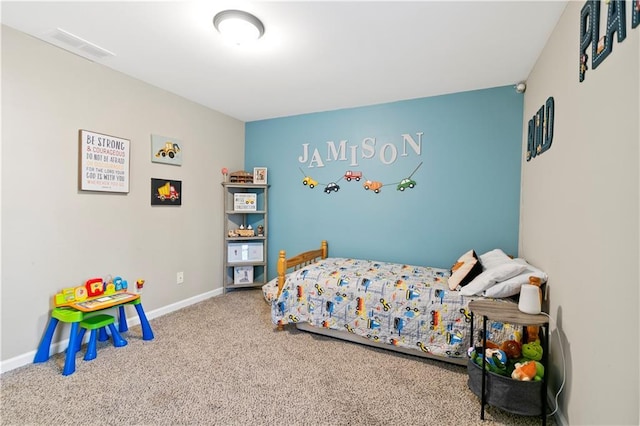 bedroom with carpet flooring, visible vents, and baseboards