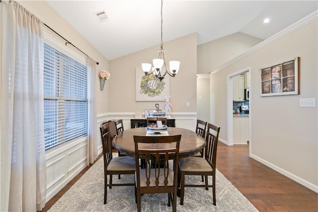 dining area with dark wood-style flooring, recessed lighting, visible vents, an inviting chandelier, and vaulted ceiling