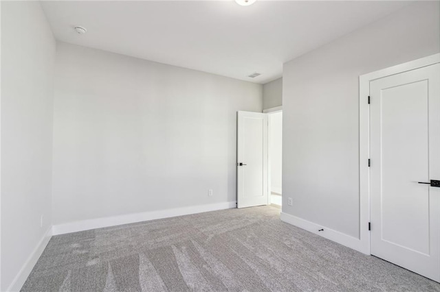 unfurnished room featuring carpet flooring