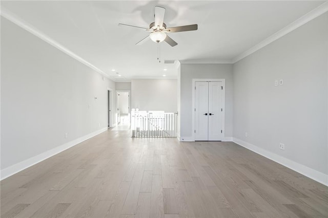 spare room with ceiling fan, light hardwood / wood-style floors, and ornamental molding