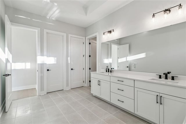 bathroom with tile patterned floors and vanity