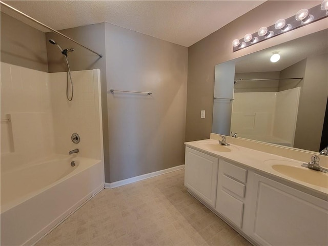 285 Fieldview Ln, Covington, GA 30016 - bathroom with bathing tub / shower combination, double vanity, and a textured ceiling