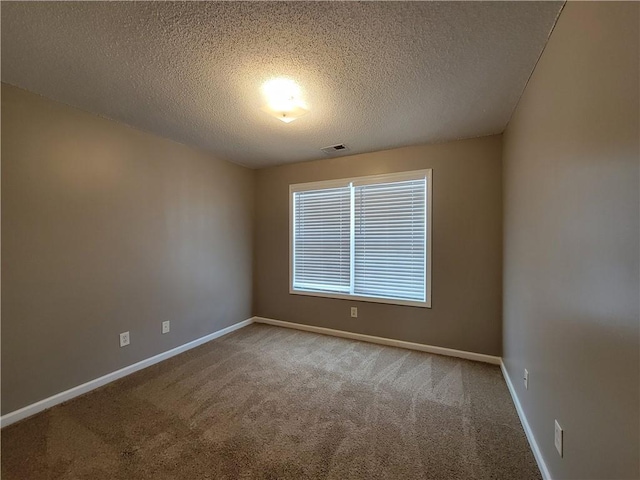 285 Fieldview Ln, Covington, GA 30016 - carpeted spare room featuring a textured ceiling and baseboards