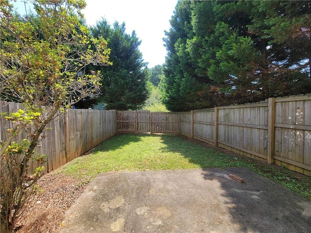 285 Fieldview Ln, Covington, GA 30016 - fenced backyard featuring a patio area