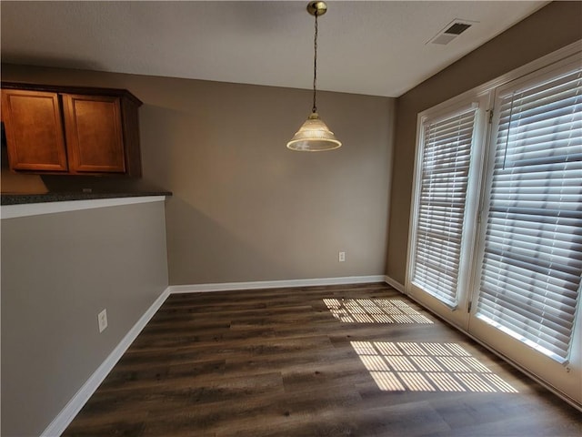 285 Fieldview Ln, Covington, GA 30016 - unfurnished dining area featuring healthy amount of natural light and dark wood-type flooring