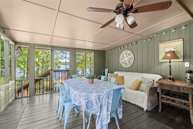 sunroom / solarium featuring ceiling fan