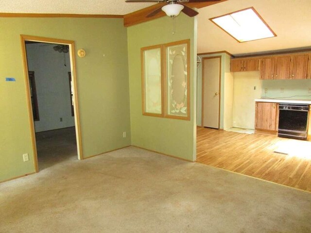 unfurnished living room with ceiling fan, light wood-type flooring, ornamental molding, a textured ceiling, and lofted ceiling