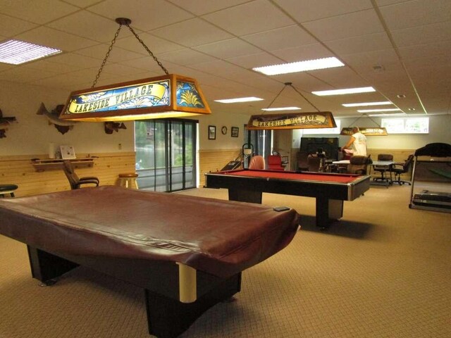 game room with carpet floors, a healthy amount of sunlight, a drop ceiling, and billiards