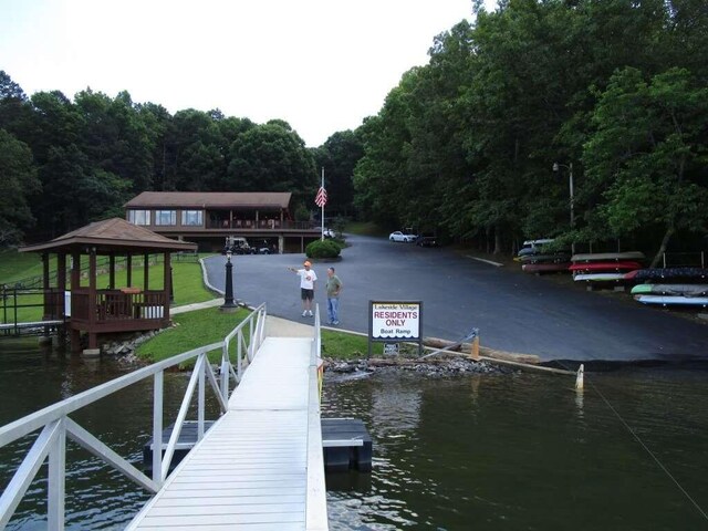 dock area featuring a gazebo and a water view