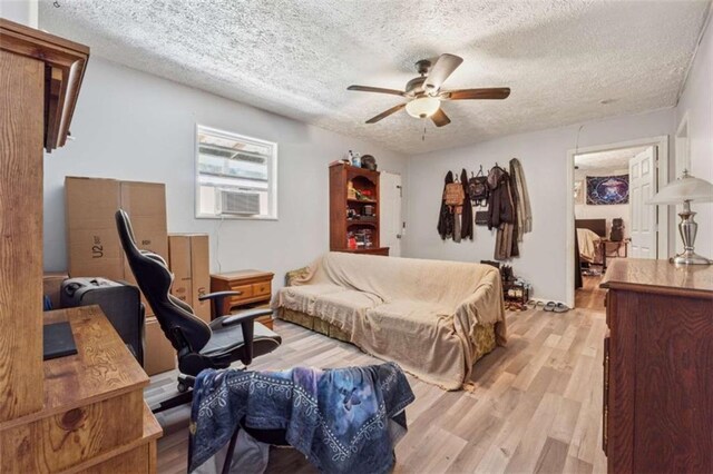 151 Grandma Branch Rd, Grantville, GA 30220 - living area featuring light wood-style flooring, a textured ceiling, and ceiling fan