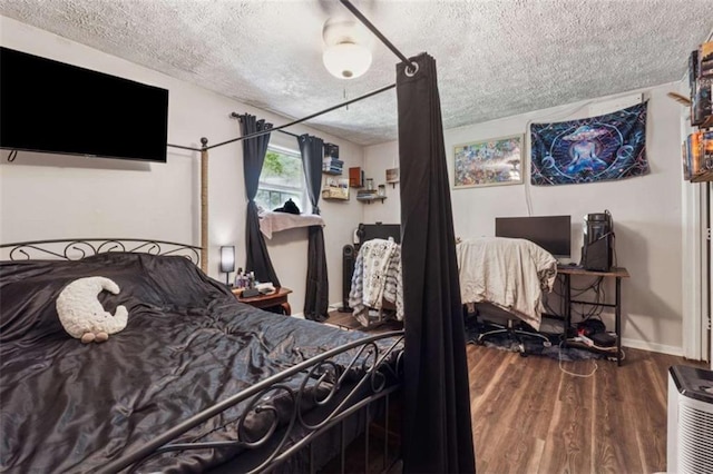 151 Grandma Branch Rd, Grantville, GA 30220 - bedroom with baseboards, wood finished floors, and a textured ceiling