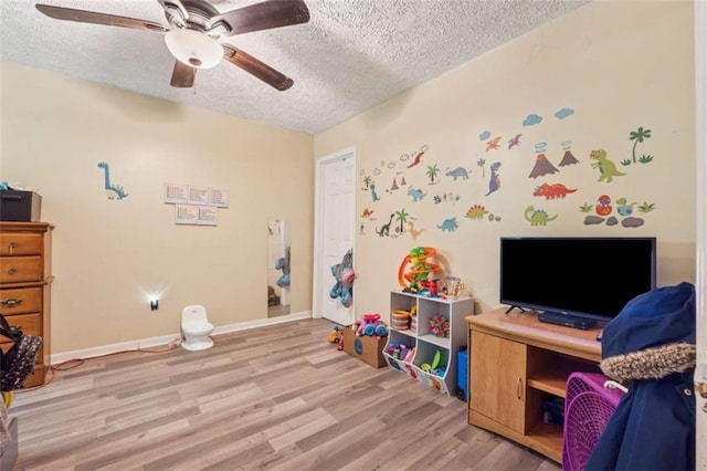 151 Grandma Branch Rd, Grantville, GA 30220 - game room featuring baseboards, a textured ceiling, light wood-style floors, and ceiling fan