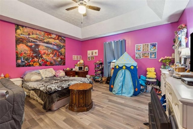 151 Grandma Branch Rd, Grantville, GA 30220 - bedroom featuring a ceiling fan, wood finished floors, and a raised ceiling