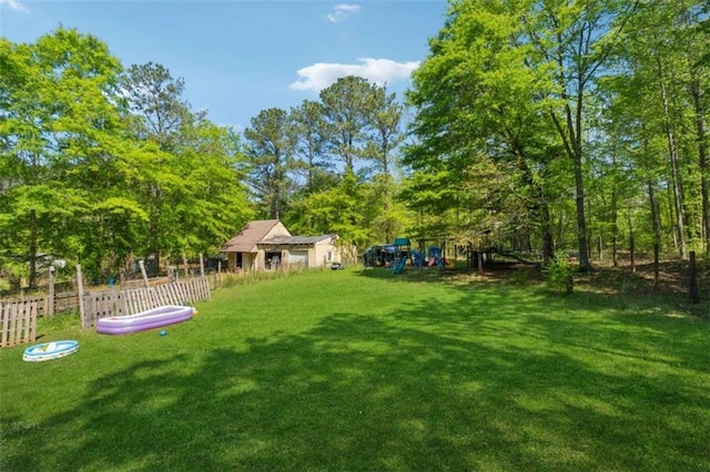 151 Grandma Branch Rd, Grantville, GA 30220 - view of yard with fence and a playground