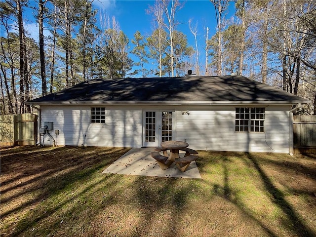 back of house with french doors, a yard, and a patio area