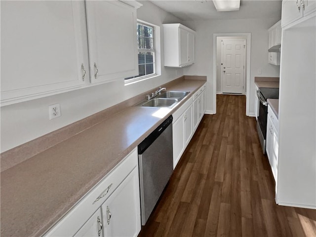 kitchen with white cabinetry, sink, range hood, dark hardwood / wood-style floors, and appliances with stainless steel finishes