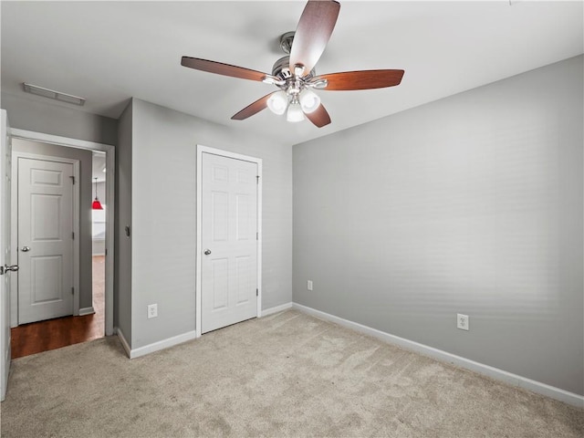 498 Walnut Woods Dr, Braselton, GA 30517 - unfurnished bedroom featuring carpet floors, baseboards, visible vents, and ceiling fan