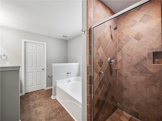 498 Walnut Woods Dr, Braselton, GA 30517 - full bathroom featuring visible vents, baseboards, stone finish floor, a bath, and a shower stall