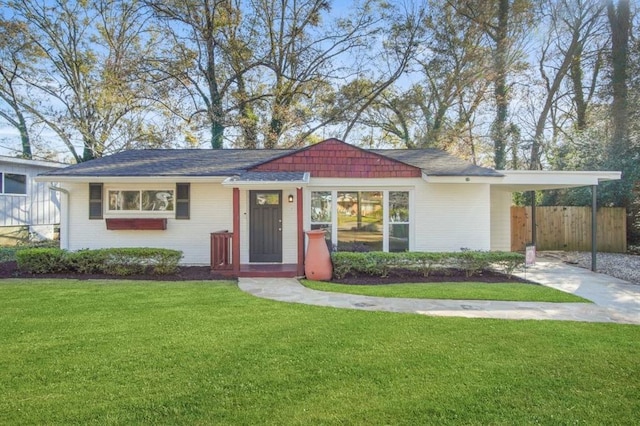 ranch-style home with a front lawn