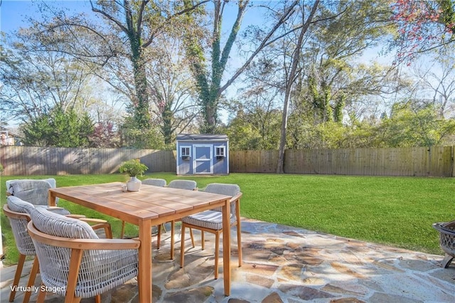 view of patio with a storage unit