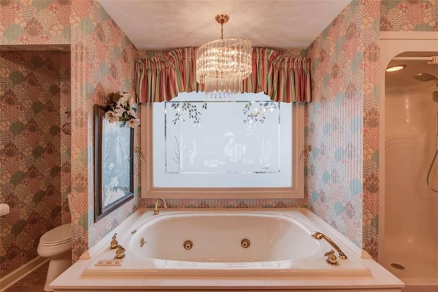 bathroom with a notable chandelier, tile patterned floors, toilet, and plus walk in shower