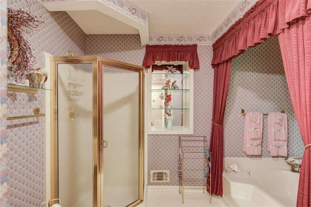 bathroom with tile patterned flooring and plus walk in shower